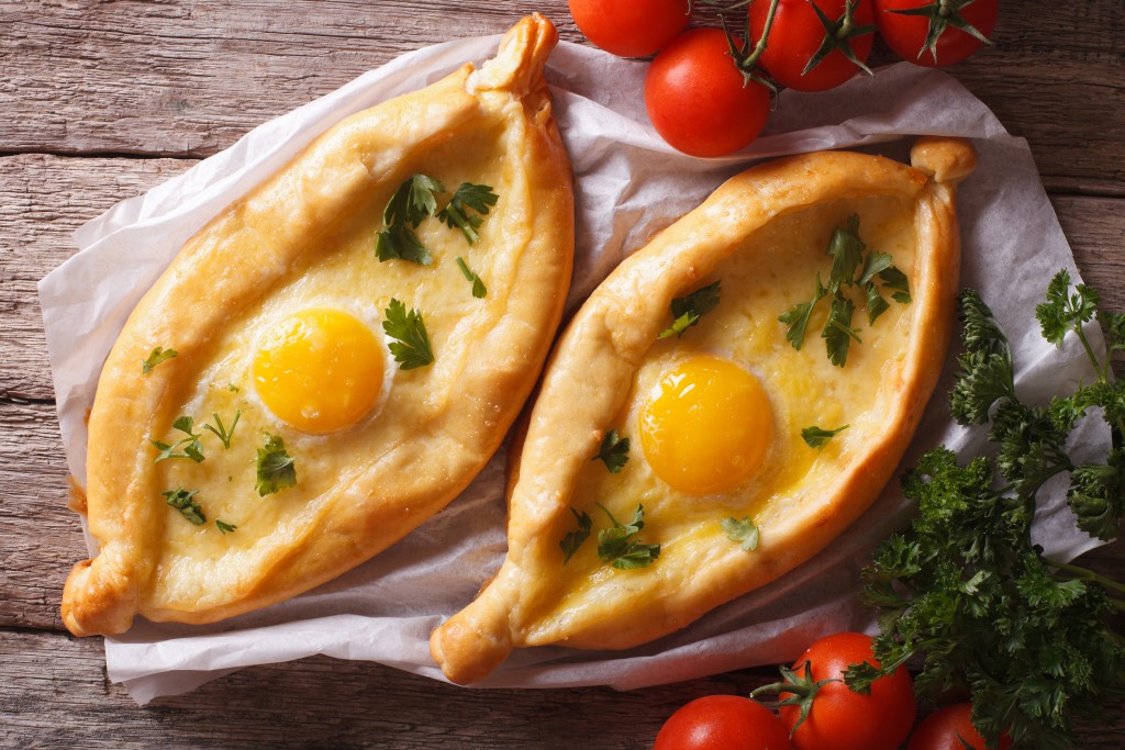 Adjarian Khachapuri And Vegetables Close-up Horizontal Top View